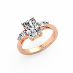 Emerald Pear Side Stone Ring